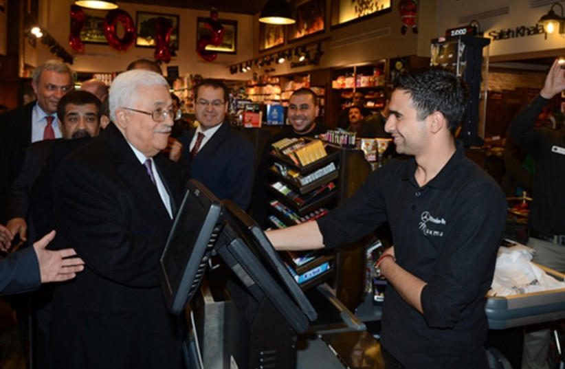 Abbas in Ramallah supermarket (photo credit: COURTESY: WAFA)