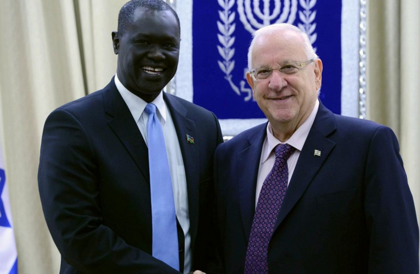 South Sudan Ambassador to Israel MR. RUBEN MARIAL BENJAMIN with President Rivlin (photo credit: Mark Neiman/GPO)
