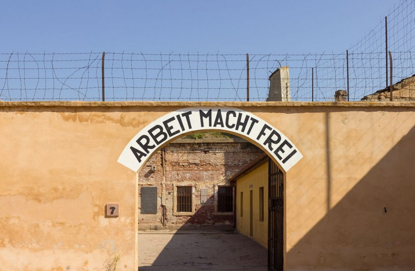 Gate with the slogan "Work makes (one) free" in  Terezín's Fortress. (photo credit: Wikimedia Commons)