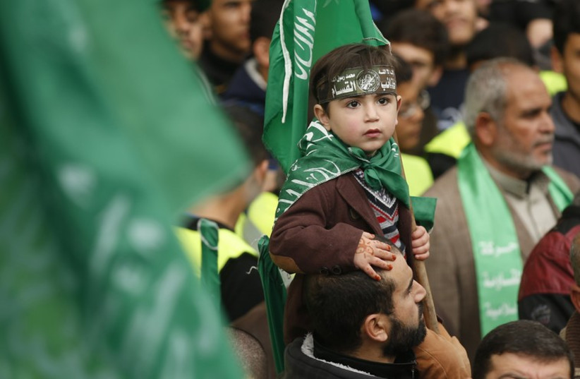 Gazans celebrate the 27th anniversary of Hamas' founding (photo credit: REUTERS)