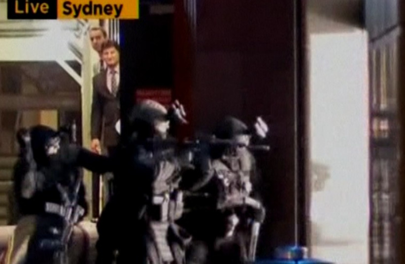 Security forces storm Sydney hostage siege cafe. (photo credit: REUTERS)