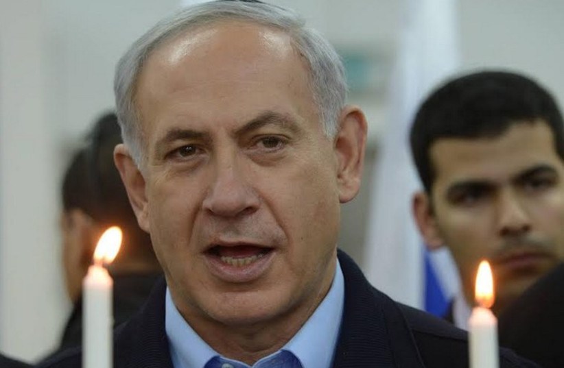 Prime Minister Benjamin Netanyahu at Hanukka ceremony, December 16, 2014 (photo credit: AMOS BEN GERSHOM, GPO)