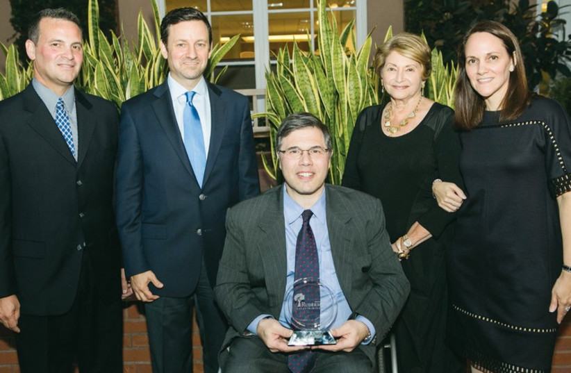 At the presentation of the Morton E. Ruderman Award in Inclusion to visiting Harvard law professor Michael Stein (center). (photo credit: NIR LANDAU)