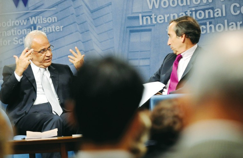 Aaron David Miller moderates a question-and-answer forum in November 2010 with then-senior Palestinian negotiator Saeb Erekat (photo credit: REUTERS)