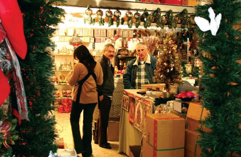 A shop selling Christmas decorations in the Old City. (photo credit: SHMUEL BAR-AM)