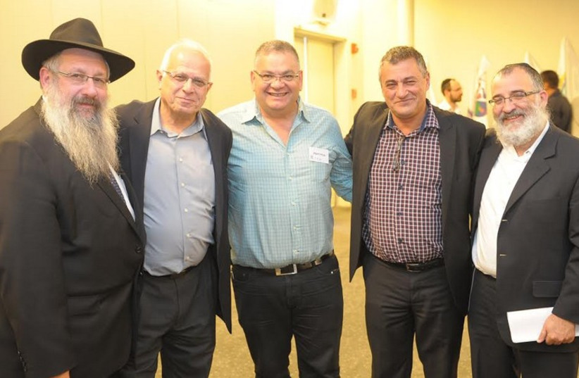 Sholom Duchman, Director of Colel Chabad, Professor Yossi Tamir, CEO of The Joint, Eli Barda, mayor of Migdal Haemek, Yossi Silman, CEO of the Ministry of Welfare and Mendy Blau, Chairman Colel Chabad (photo credit: Courtesy)
