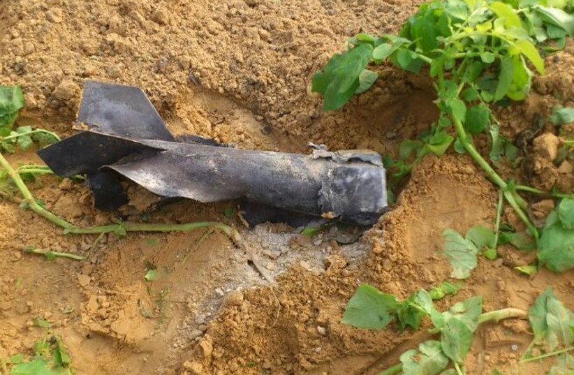 Rocket fragment found by secuirty forces in an open field, December 19,2014 (photo credit: Courtesy)