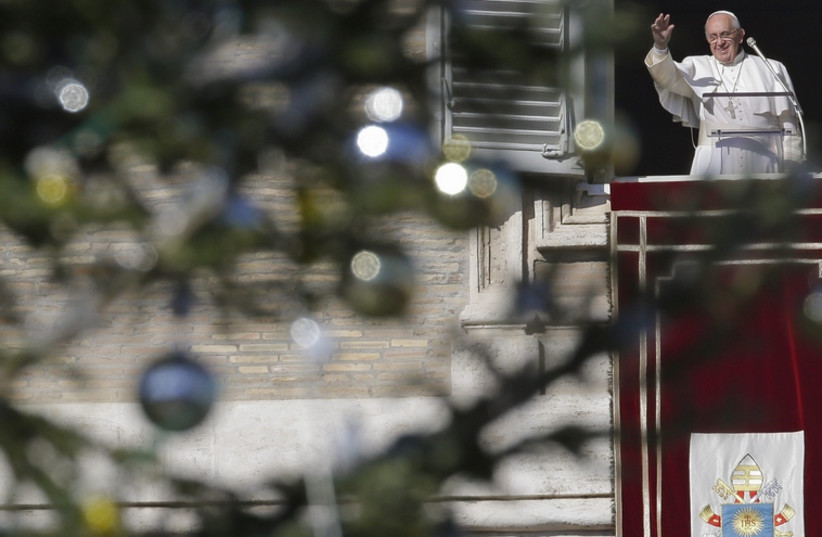 Pope Franis extends holiday greetings at the Vatican (photo credit: REUTERS)