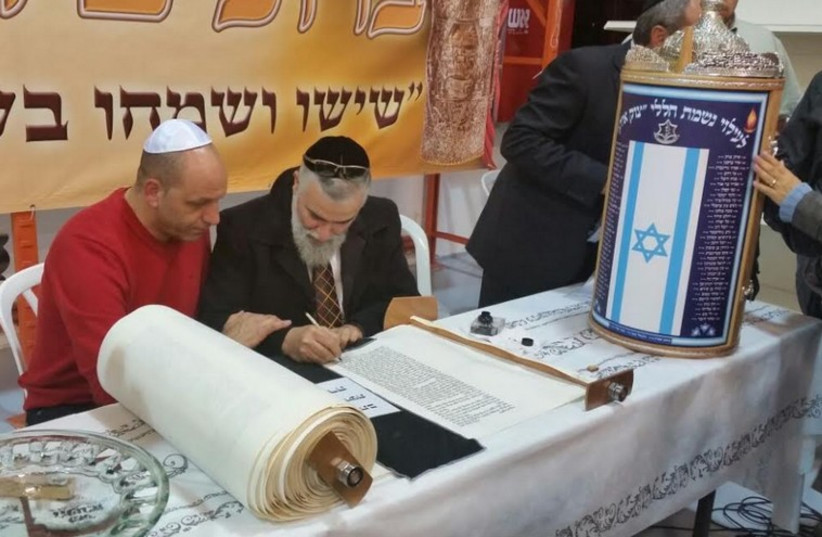 Torah scroll dedicated in name of fallen soldiers from Gaza conflict (photo credit: ALBERT GABBAI)