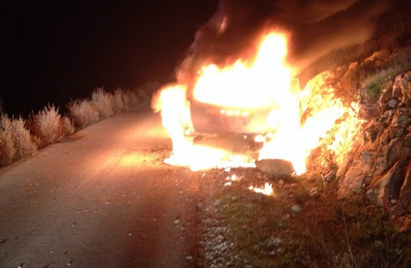 Car damaged by molotov cocktail in West Bank, December 25th 2015 (photo credit: ZAHI TEAM KARNEI SHOMRON)