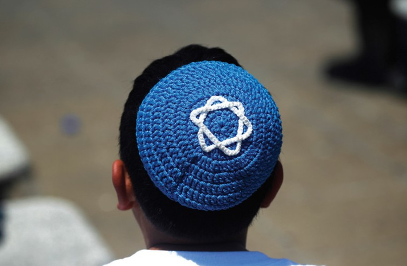 A boy wears a yarmulke (photo credit: REUTERS)