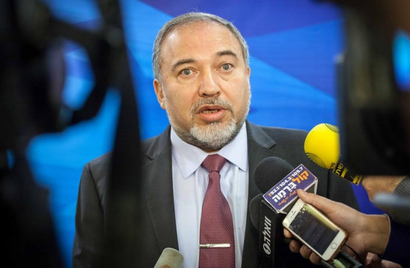 Foreign Minister Avigdor Liberman speaks to the press before the weekly cabinet meeting in Jerusalem (photo credit: EMIL SALMAN/POOL)