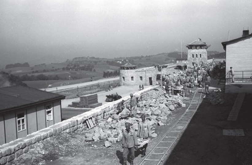 Prisoners work in the Mauthausen-Gusen concentration camp during World War II. (photo credit: Wikimedia Commons)
