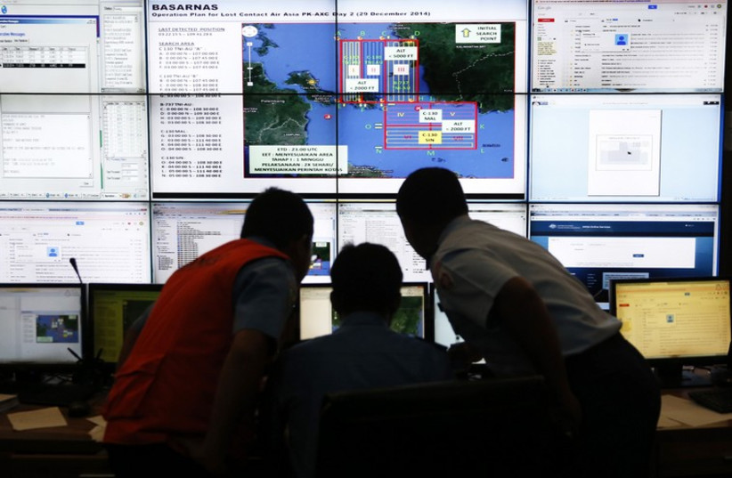 Authorities monitor progress in search for AirAsia Flight. (photo credit: REUTERS)