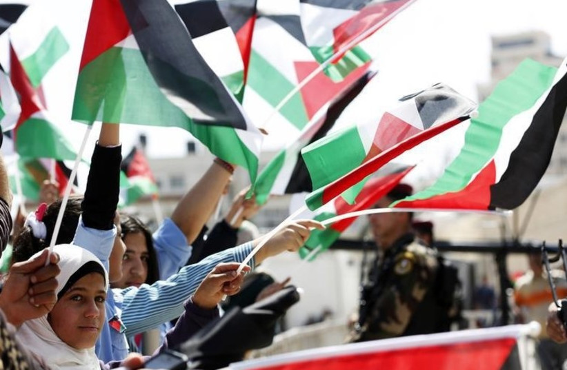 Palestinians in the West Bank city of Ramallah (photo credit: REUTERS)