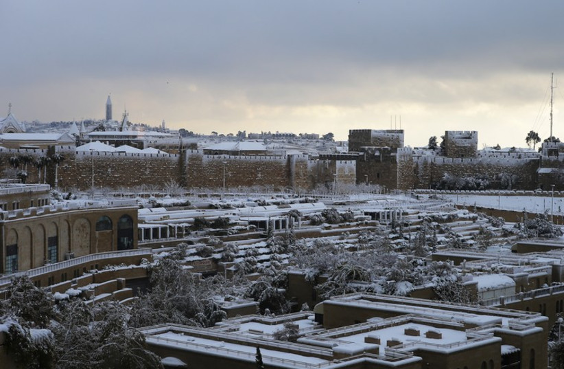 Snow covers the city during a snow storm in Jerusalem December 13, 2013 (photo credit: REUTERS)