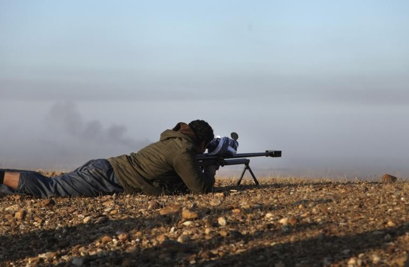 A member of the Kurdish forces engaged in the battle against Islamic State (photo credit: REUTERS)