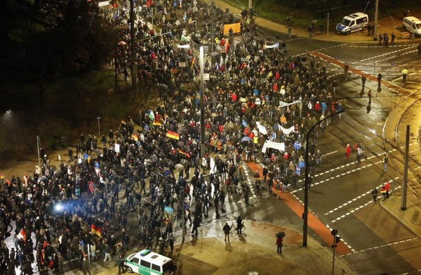 Protesters rally against anti-Muslim immigrant group PEGIDA in Dresden