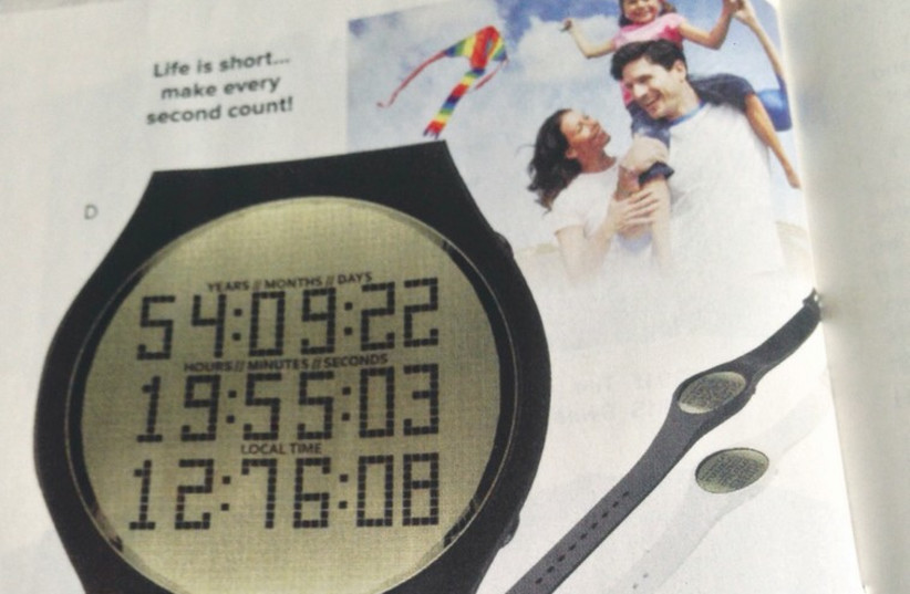 An advertisement for a ‘Happiness’ watch that counts down your life. (photo credit: STEWART WEISS)