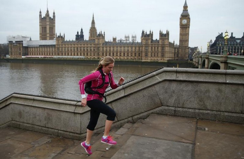 A jogger goes on a run through central London (photo credit: REUTERS)