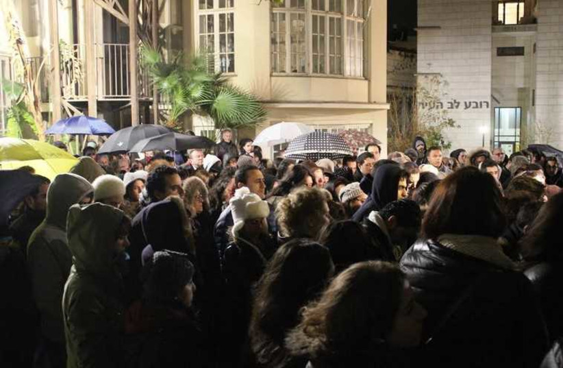 French Jews in Tel Aviv commemorate victims of Paris terror attacks  (photo credit: BEN HARTMAN)