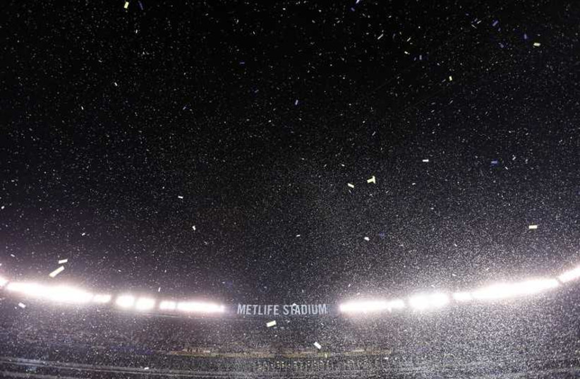 Confetti floats in the air during post game  celebrations as the Seattle Seahawks defeated the Denver Broncos in the NFL Super Bowl XLVIII football game in New Jersey, February 2, 2014 (photo credit: REUTERS)