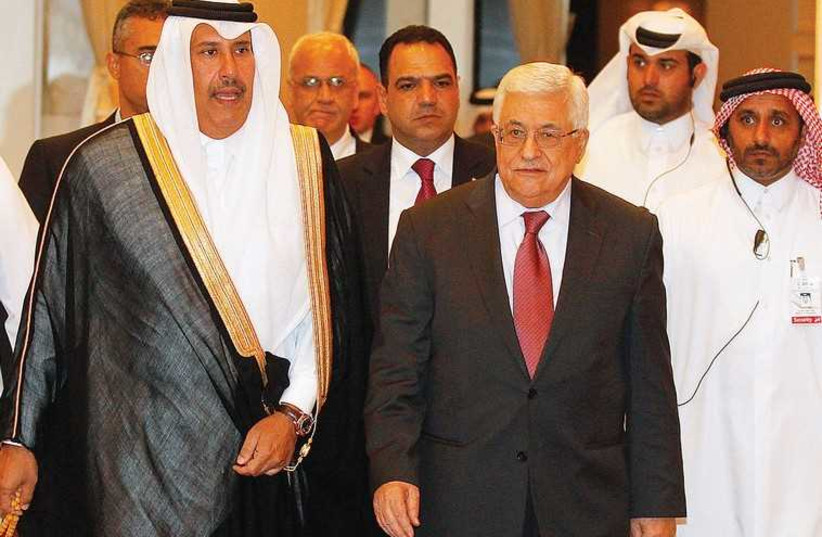 PA PRESIDENT Mahmoud Abbas (front right) and Qatar’s prime minister Hamad bin Jassim bin Jabr Al-Thani arrive at a meeting of the Arab Peace Initiative Committee in Doha in 2013. (photo credit: REUTERS)