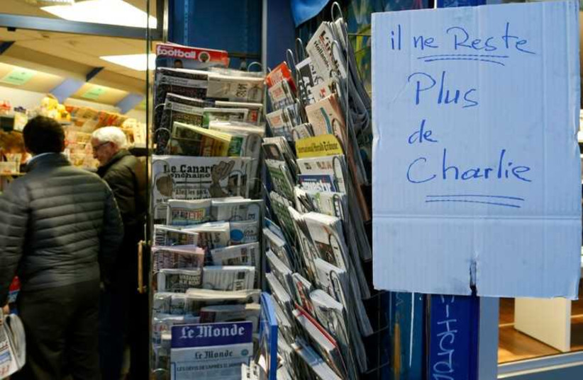 Handwritten sign at Paris newstand reads 'No more Charlie' as copies of satirical magazine Charlie Hebdo sell out (photo credit: REUTERS)