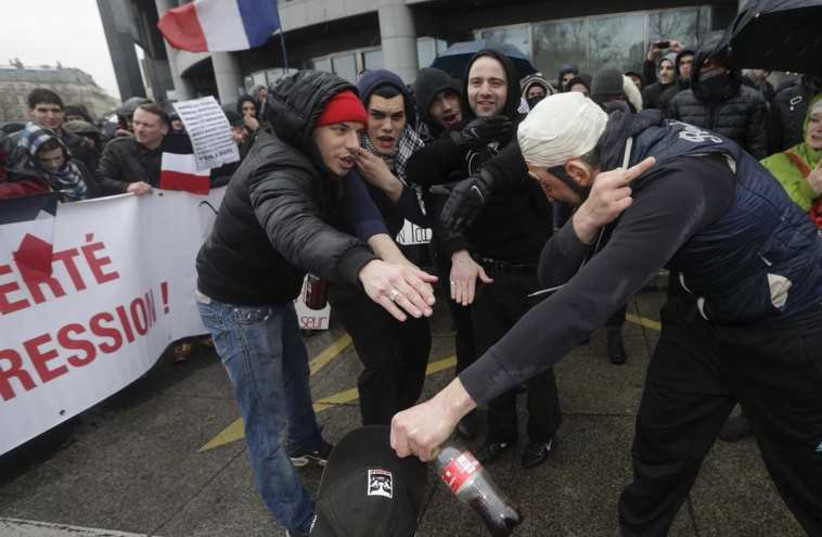 Demonstrators make a salute called "quenelle". (photo credit: REUTERS)