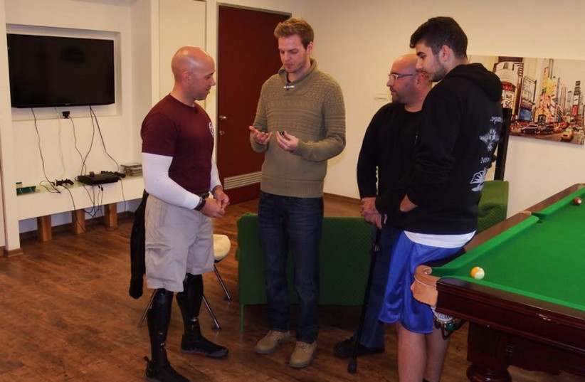 Staff Sgt. Brian Mast meeting with injured IDF veterans. (photo credit: Courtesy)