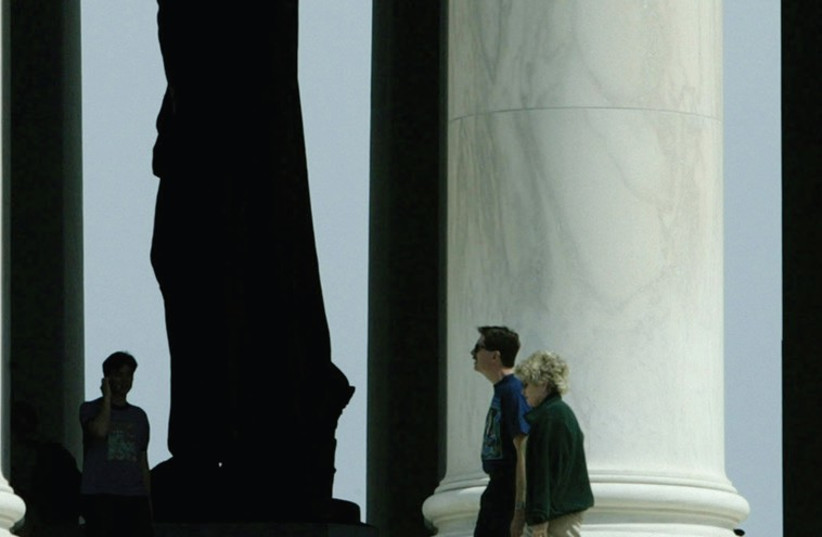 TOURISTS STROLL around the memorial to former US president Thomas Jefferson in Washington. (photo credit: REUTERS)