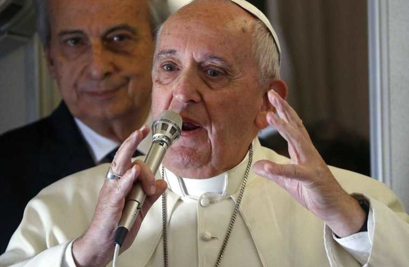  Francis gestures as he speaks with journalists on his flight back from to Rome (photo credit: REUTERS)