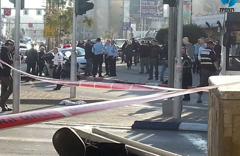 Man stabs passengers on the 40 bus line, near Tel Aviv's Maariv junction, January 21  (photo credit: TAZPIT)