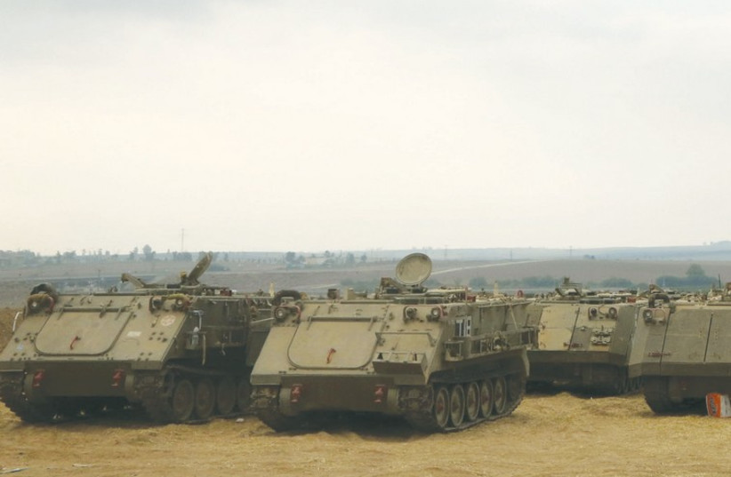 IDF forces gather in the South near the border with the Gaza Strip on July 23, 2014. (photo credit: MARC ISRAEL SELLEM/THE JERUSALEM POST)