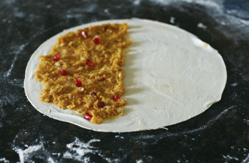 Making Gutabs with a filling of butternut squash and pomegranate arils (photo credit: FERIDE BUYURAN)