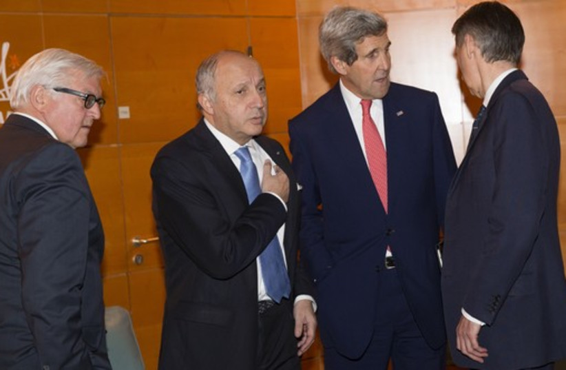 U.S. Secretary of State John Kerry (2nd R) talks with German Foreign Minister Frank-Walter Steinmeier (L), French Foreign Minister Laurent Fabius and British Foreign Minister Philip Hammond (R) in Paris (photo credit: REUTERS)