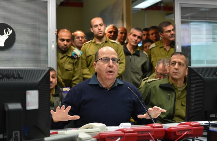 Defense Minister Moshe Ya'alon visiting the IDF Northern Command headquarters with Northern Command chief Maj.-Gen. Aviv Kochavi to his right (photo credit: ARIEL HERMONI / DEFENSE MINISTRY)