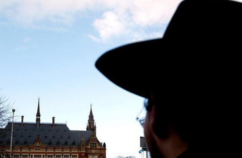 A Jewish man gazes at the Peace Palace in The Hague (photo credit: REUTERS)