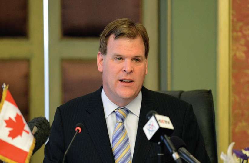 CANADA’S MINISTER of Foreign Affairs John Baird speaking in Egypt on January 15 (photo credit: REUTERS)