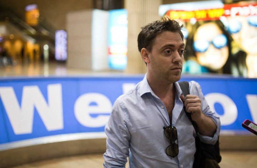 Damian Pachter, a journalist with the Buenos Aires Herald, arrivals hall at Ben-Gurion Airport (photo credit: REUTERS)