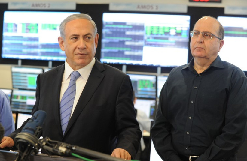 Prime Minister Benjamin Netanyahu visits Israel Aerospace Industries‏. (photo credit: POOL/AVSHALOM SASSONI)