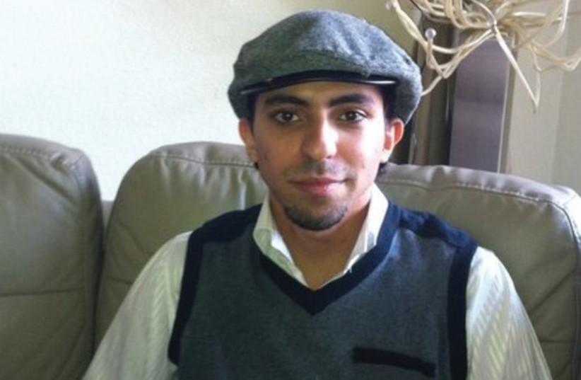 IMPRISONED AND flogged blogger Raif Badawi: his cyber-activity was deemed apostasy. (photo credit: REUTERS)