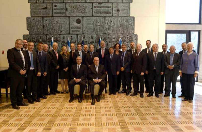 President Reuven Rivlin with 26 present and future Israel ambassador to Latin America  (photo credit: Mark Neiman/GPO)