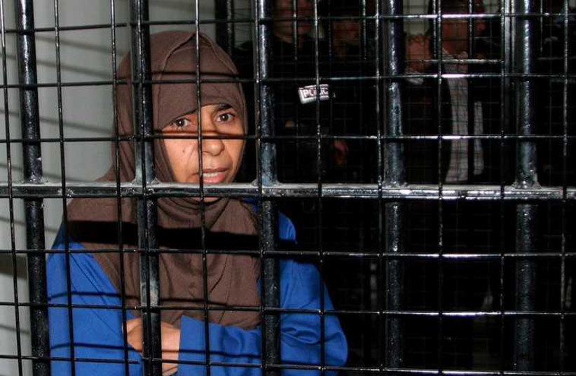 Iraqi Sajida al-Rishawi, 35, stands inside a military court in Amman [File] (photo credit: REUTERS)