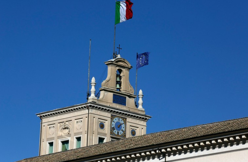The Italian and EU flags flutter in the wind at the Quirinale presidential palace in Rome (photo credit: REUTERS)