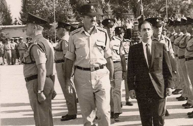 Police minister Hillel inspects his troops in the 1970s ; (right) Let my people go: Aliya agent Hillel in Baghdad (photo credit: COURTESY SHLOMO HILLEL)