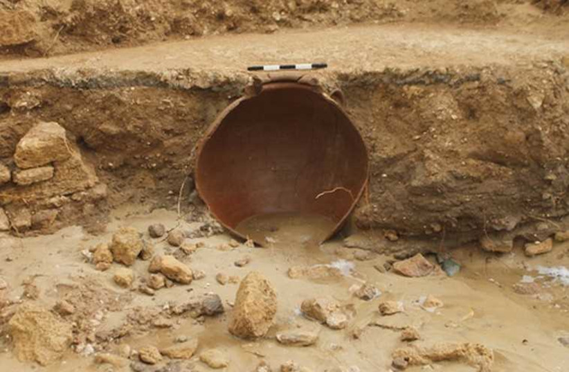 THE ANCIENT clay jug rescued in Yavne-Yam during Wednesday’s storm. (photo credit: Israel Antiquities Authority)
