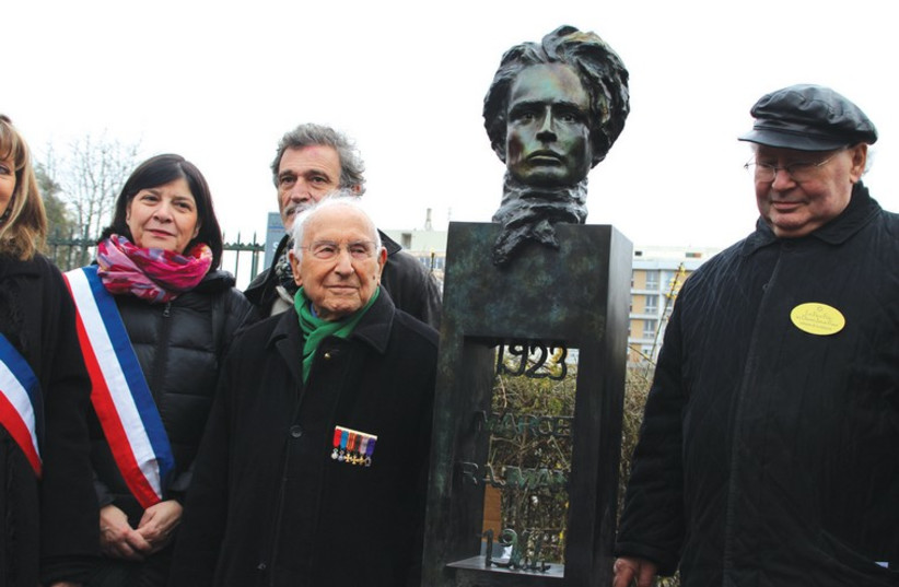 NAZI HUNTER Serge Klarsfeld (right), resistance veteran Roger Fichtenberg (center) and sculptor Denis Chetboun stand next to the newly inaugurated statue of Marcel Rajman in Paris on Sunday. (photo credit: RINA BASSIST)