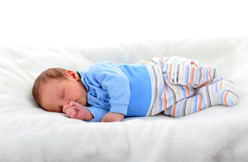 Baby boy in sleeping on bed (photo credit: ING IMAGE/ASAP)