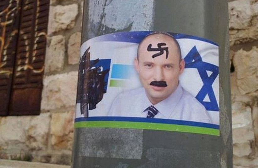 Picture of Naftali Bennet vandalized with Swastika and "Hitler mustache" which led to heightened security (photo credit: 0404 NEWS)